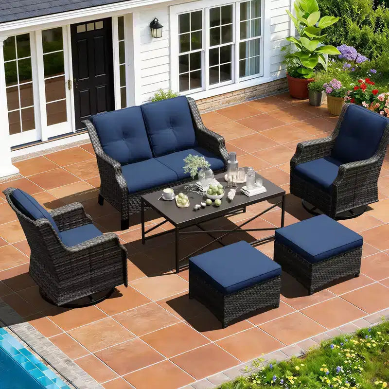 Salon de jardin UPTIOT avec canapé, fauteuils à bascule, poufs et table basse pour un confort relaxant dans le jardin.
